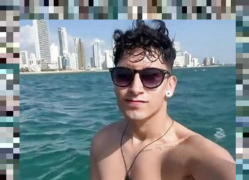 tourist exhibits himself in a boat in the sea on the Beaches of Cartagena