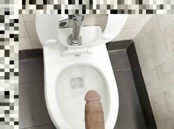 Pissing and cuming in public bathroom.