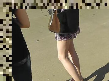 Cute leggy beauty being upskirted