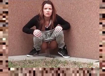 Cute brunette caught going pee outdoors