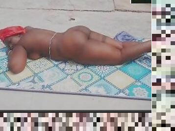 Ebony lesbian babe sun bathing outdoors naked