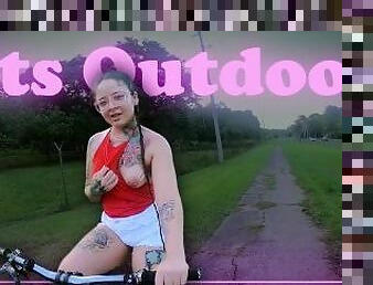 Riding a bike and showing my tits. Outdoor
