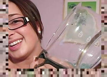 Busty brunette wearing glasses put a dildo in her wet hole